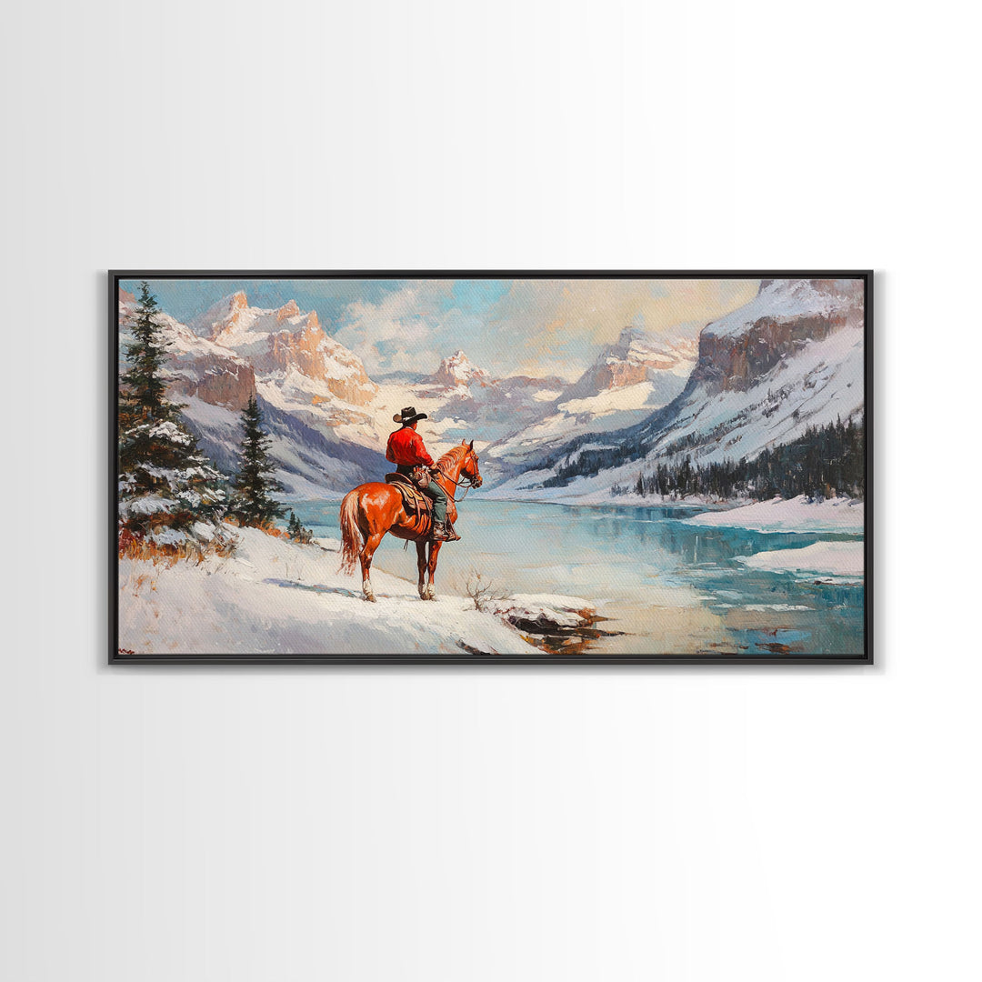 Cowboy on horseback near hay bale outside rustic barn, snow-covered landscape, Framed Canvas Print, winter wall art, rustic farmhouse decor