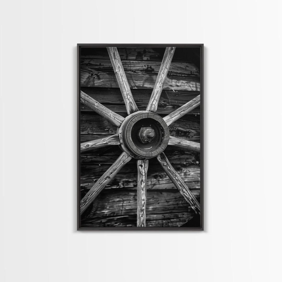 Rustic wagon wheel against wooden background, black and white Western decor Framed Canvas Print, vintage wall art for home living room decor