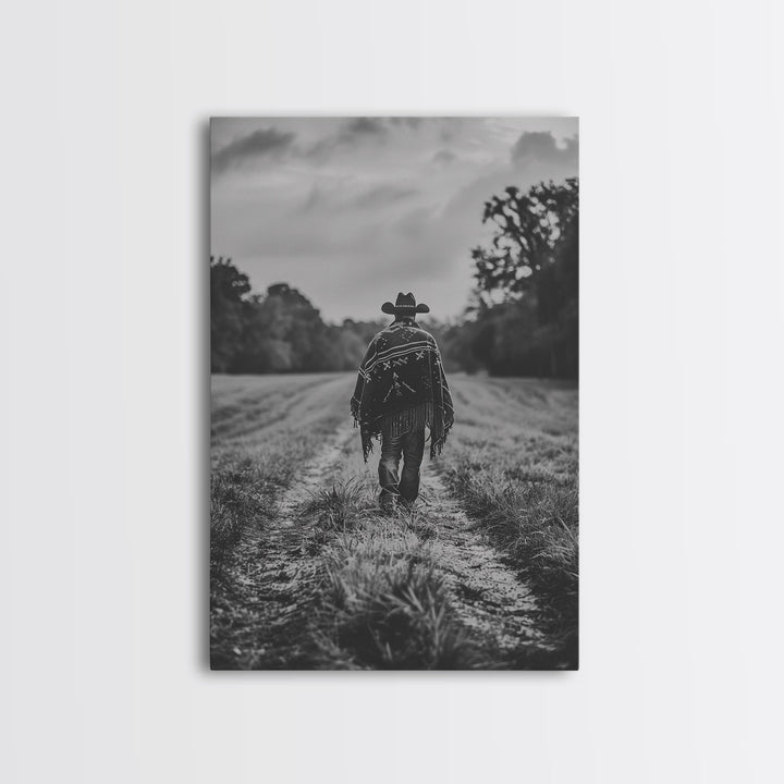 Lone cowboy walking on dirt path, black and white photography, Framed Canvas Print, rustic Western decor, vintage wall art for home