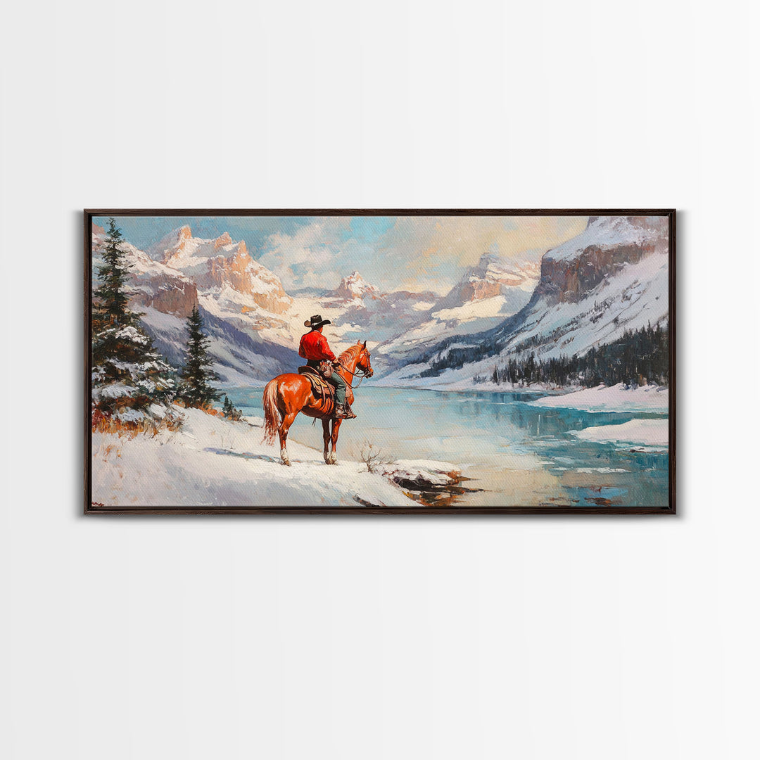 Cowboy on horseback near hay bale outside rustic barn, snow-covered landscape, Framed Canvas Print, winter wall art, rustic farmhouse decor