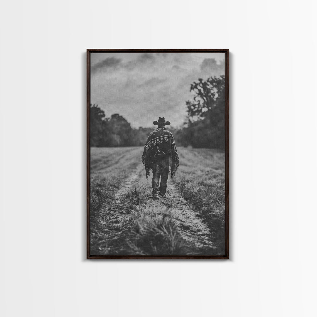 Lone cowboy walking on dirt path, black and white photography, Framed Canvas Print, rustic Western decor, vintage wall art for home