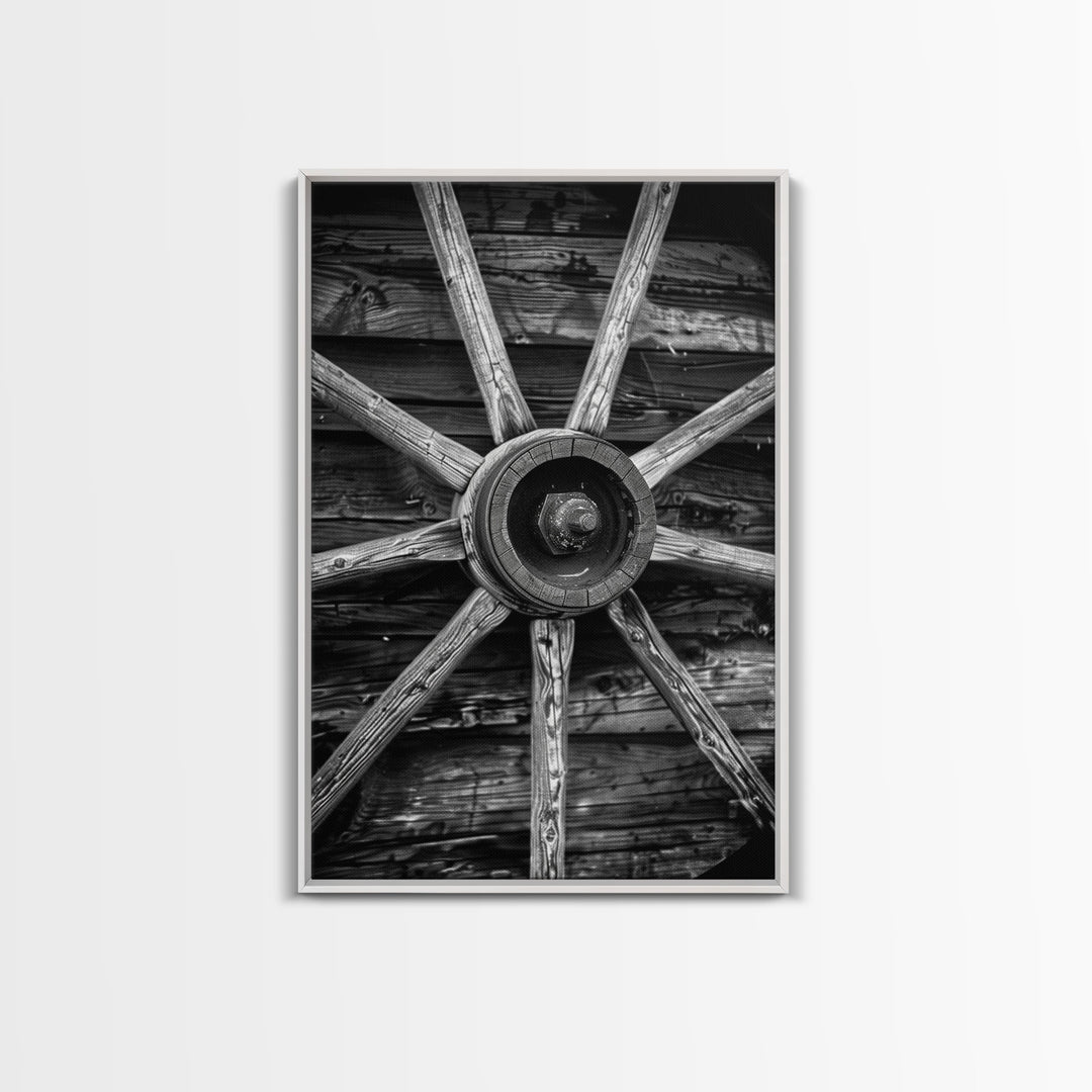 Rustic wagon wheel against wooden background, black and white Western decor Framed Canvas Print, vintage wall art for home living room decor