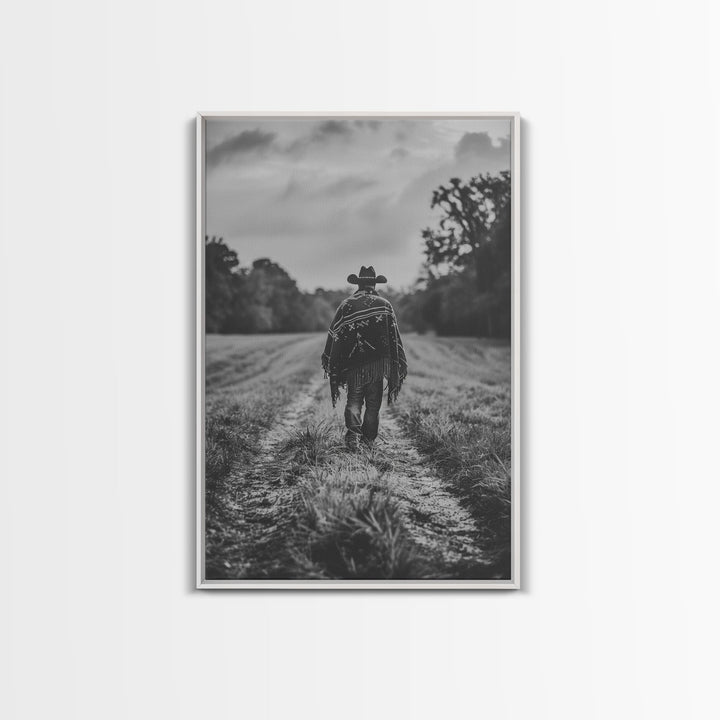 Lone cowboy walking on dirt path, black and white photography, Framed Canvas Print, rustic Western decor, vintage wall art for home