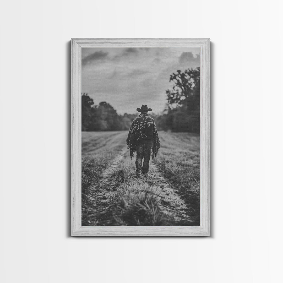 Lone cowboy walking on dirt path, black and white photography, Framed Canvas Print, rustic Western decor, vintage wall art for home