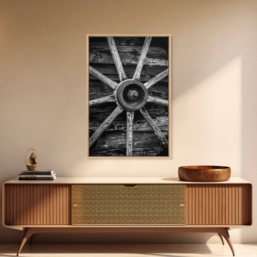 Rustic wagon wheel against wooden background, black and white Western decor Framed Canvas Print, vintage wall art for home living room decor